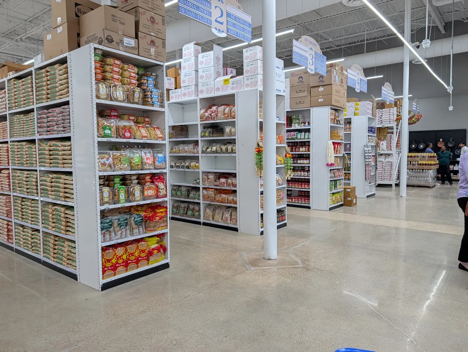 Shelves stocked with Indian snacks, flours and dry goods at Big Basket